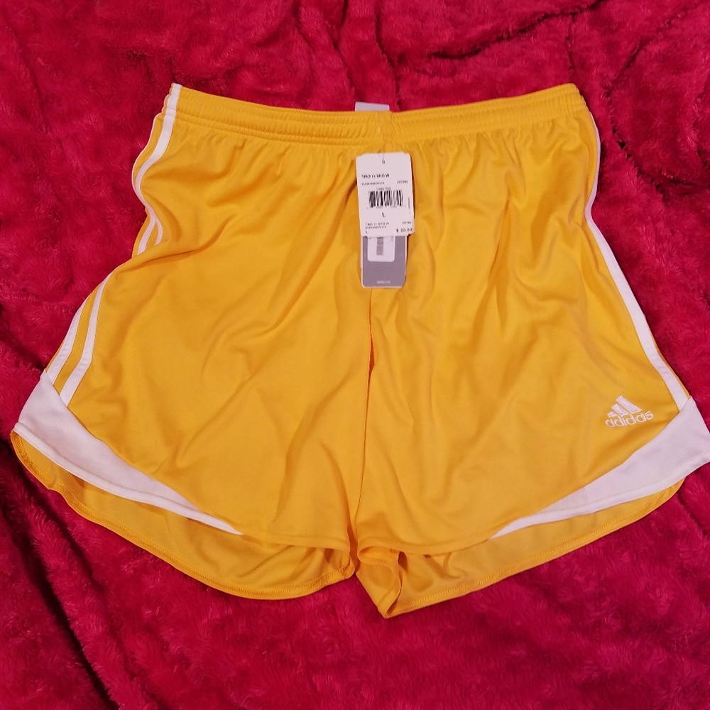 Yellow Gold Adidas soccer shorts.